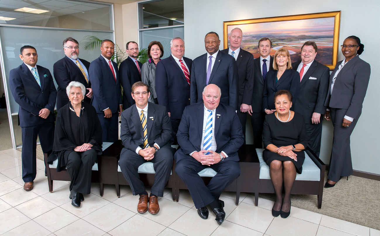 Office personnel posing for a group photo