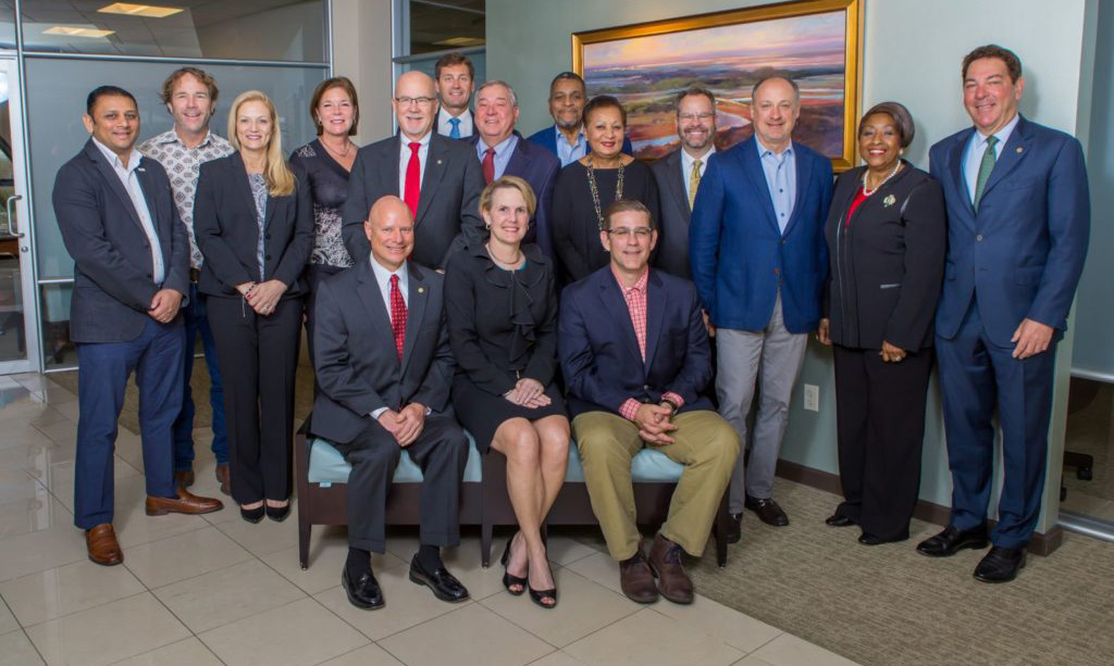 Office personnel posing for a group photo