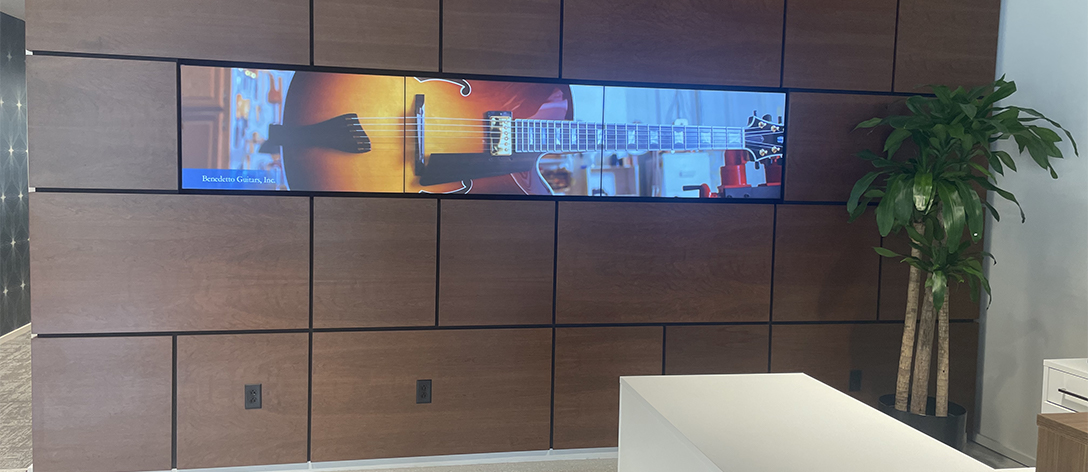 Wall with wood panels and tv