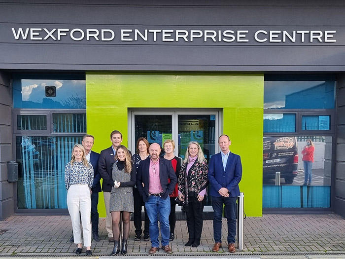 Group of professional men and women in front of Wexford Enterprise Centre building